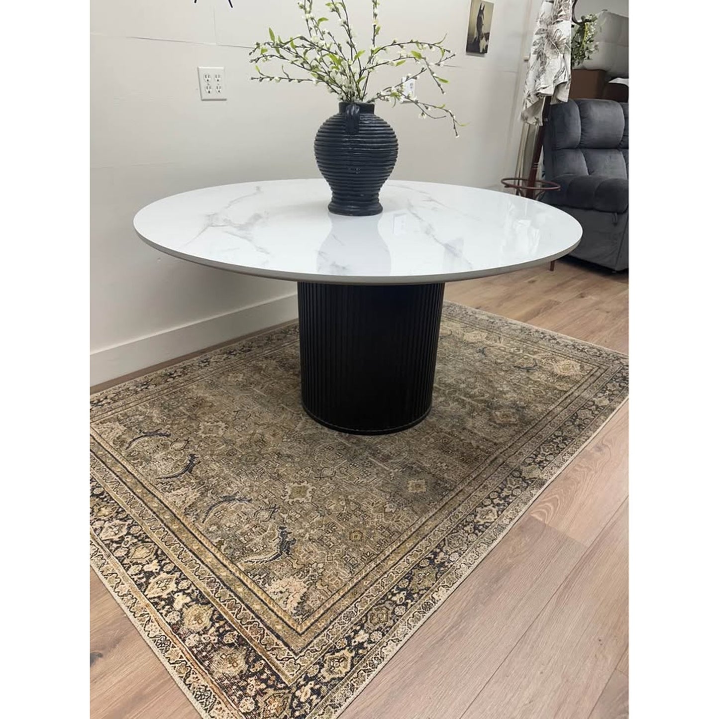 Colvin 54-Inch Round White Marble Table Black Ribbed Base By Steve Silver