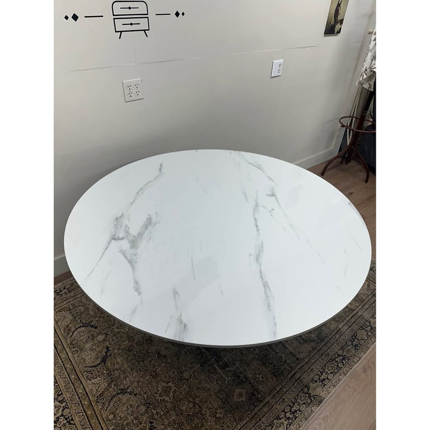 Colvin 54-Inch Round White Marble Table Black Ribbed Base By Steve Silver